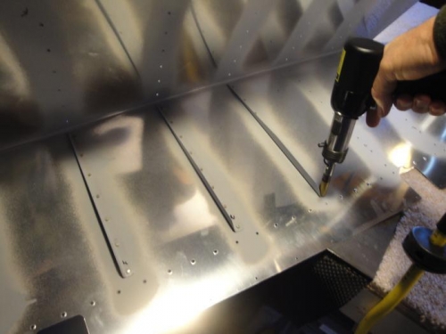 Back-riveting stiffeners to skins