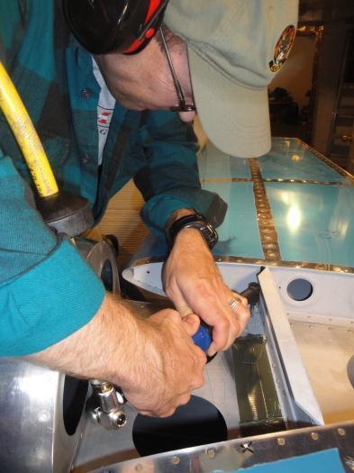 Rich Donnelly takes his turn drilling through the forward shims