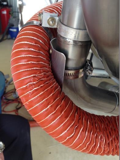 Footheat scat tube repositioned, heat-protected