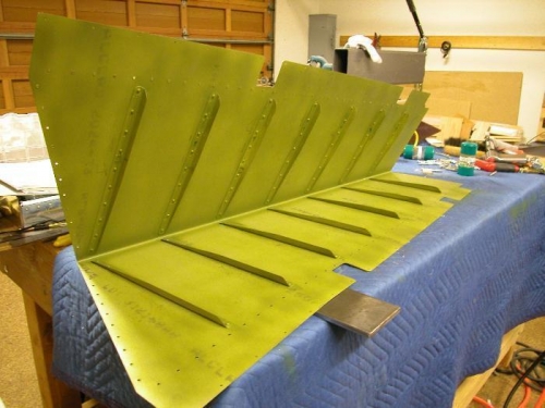 Riveted stiffeners to right skin.