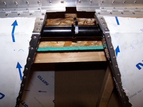 Showing underside; elevator is hanging down, showing hinge & fore edge of elevator