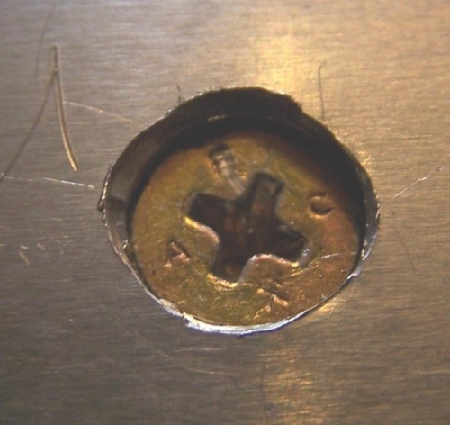 Over-Countersunk screw on forward side of Right wing spar. Depth is limited to main web. Looks deeper.