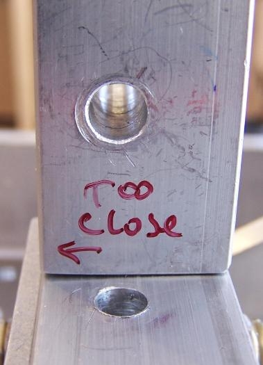 Old Block on top; new on bottom showing hole offset.