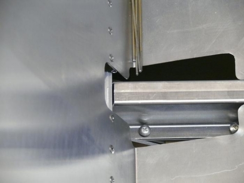 Showing interference of hat section to seat hinge pins