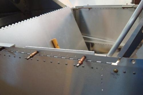 Lower hinge riveted to Fuselage; canopy hinge pinned in place and spaced for alignment