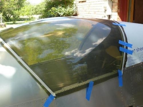 Fwd edge trimmed, aft edge taped, starboard side