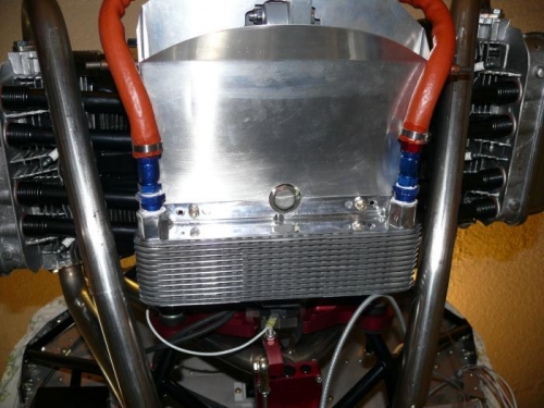 More from underneath; note cutout in cooler flange for oil drain