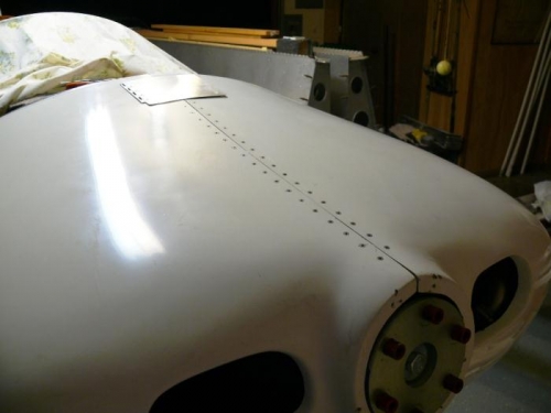 Overall shot of riveted cowl halves fitted to fuselage