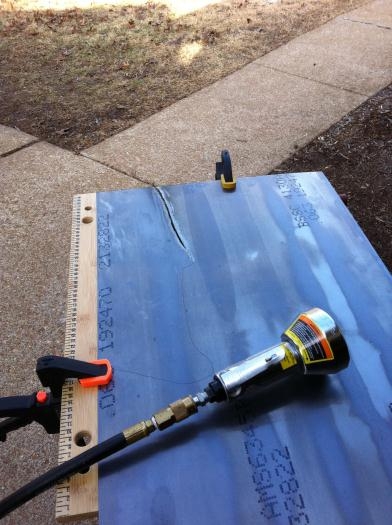 Rough cutting 4130 steel for engine mount brackets.