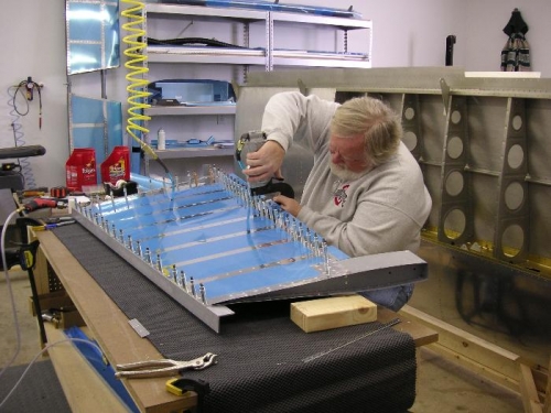 Squeezing the skin to spar rivets