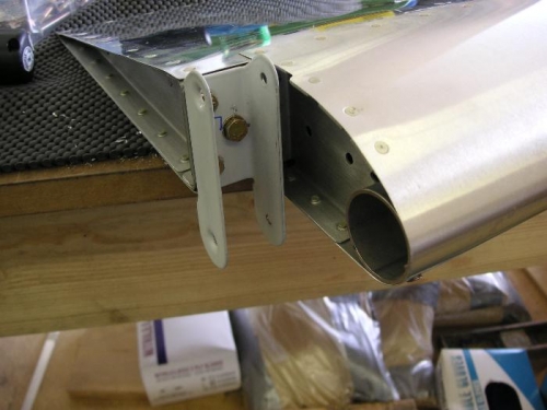 attached brackets to aileron, fabricated spacers