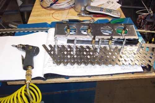 using the rivet fan to space the rivets.