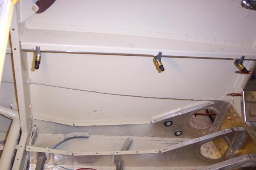 Angle strut clamped in place under armrest