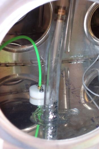 Bottom port next to drain line