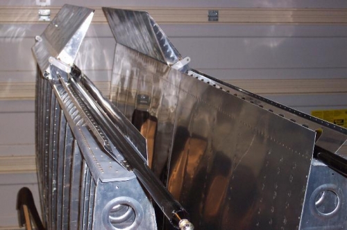 Both ailerons installed and ready for the large pushrod installation.