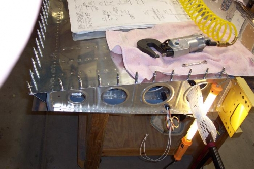 Riveting every other inboard hole.