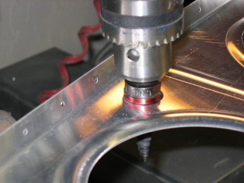 Drilling the hole for the conduit in the wing