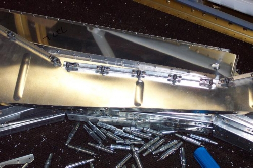 Nutplates riveted on the rib.