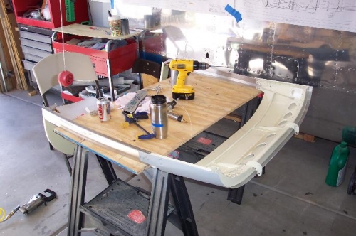 Frame on work table riveting bottom rivets