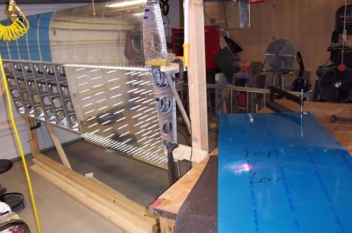 Dimpling the outboard top skin