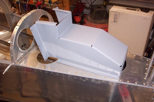 Booster pump cover riveted and primed