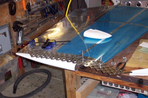 Drilling holes to attach the tip.